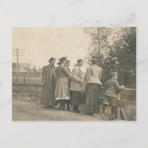 5 people overlooking bridge postcard
