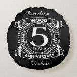 5th wedding anniversary distressed crest round cushion<br><div class="desc">A design to celebrate your fifth year of marriage. This first wedding anniversary design has a distressed white crest,  with the text wood,  5 year ,  anniversary.  If you would like any help customising this design please contact me,  their is an ask this designer button,  just below this text.</div>