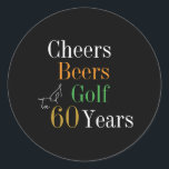 60th Birthday Cheers and Beers Golf Black and Gold Classic Round Sticker<br><div class="desc">This is a cool and modern, 60th birthday, golf party design. It is a simple, minimal design, in classic black and gold typography with pops of orange and green. Perfect for a cool and fun, golf and beer themed, 60th birthday party. This design is fully customisable, simply use the personalise...</div>