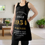70th Birthday 1954 Name Chic Elegant Black Gold Apron<br><div class="desc">Elegant Black & Gold Chic Apron - 70th Birthday 1954 Name Personalised Kitchen & BBQ Essentials. Celebrate a fabulous birthday with style and practicality! This Elegant Black & Gold Chic Apron, personalised for those born in 1954, is the perfect accessory for the culinary enthusiast in your life. Its eye-catching design,...</div>