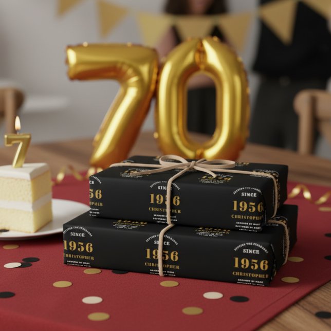 70th Birthday born 1956 Add Name Black Gold Wrapping Paper Sheet (70th birthday wrapping paper on a table.)
