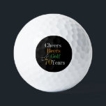 70th Birthday Golf Cheers and Beers Black and Gold Golf Balls<br><div class="desc">This is a cool and modern, 70th birthday, golf design. It is a simple, minimal design, in classic black and gold typography with pops of orange and green. Perfect for a cool and fun, golf and beer themed, 70th birthday gift or party accessory and ideal as birthday keepsakes or party...</div>