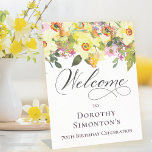 70th Birthday Yellow Daffodil Wildflower Welcome Pedestal Sign<br><div class="desc">Pretty springtime flower arrangement features yellow daffodils and purple wildflowers nestled in greenery. This tabletop sign stands up on its own. Just one less thing to think about, right? The calligraphy adds an elegant touch. This item is part of the Rustic Boho Yellow Daffodil collection. It lets you choose a...</div>