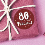 80 and Fabulous Glitter Red 80th Birthday Classic Round Sticker<br><div class="desc">80 and Fabulous Glitter Red 80th Birthday Sticker. 80 and fabulous text in trendy white script with a name on a dark red background. Personalise it with your the age.</div>