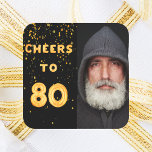80th birthday black fold cheers men square sticker<br><div class="desc">A trendy 80th birthday party sticker. With the text: Cheers to 80 on front written with faux gold balloon letters. Black background with golden confetti. Template for your photo.</div>