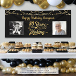 80th Birthday Black Gold String Lights Photos Banner<br><div class="desc">Celebrate an 80th birthday with this banner sign featuring a retro gold typography title design of 80 YEARS IN THE MAKING that incorporates his or her birth year as part of the design, 2 photos (fun to include Then and Now photos), gold string lights and your personalised custom message (the...</div>