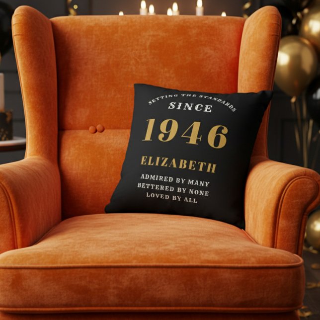 80th Birthday Gift Personalized 1946 Black Gold Cushion (A vibrant orange velvet wingback armchair with a black throw pillow for an 80th birthday celebration)