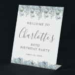 80th Birthday Party Dusty Blue Floral Welcome Pedestal Sign<br><div class="desc">Welcome your guests with this elegant tabletop pedestal sign. Pretty dusty blue roses,  peonies and wildflowers decorate the top and border. A classic and easy-to-read font combination takes only minutes to personalise.</div>