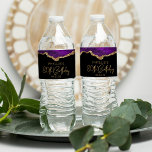 80th Birthday Party Purple Gold Agate Water Bottle Label<br><div class="desc">These chic 80th birthday water bottle labels feature a watercolor image of an agate geode in shades of purple with faux gold glitter highlights. The words "80th Birthday" appear in faux gold glitter in a decorative modern handwriting font. Customise it with the name of the guest of honour and the...</div>