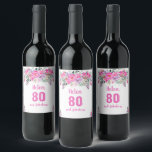 80th birthday pink floral wine label<br><div class="desc">Elegant design for a 80th birthday party with a pink "80 & fabulous" and a scripted name,  embellished by a feminine floral design on a white background. Customise name,  age,  text and background colour.</div>
