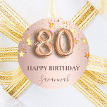 80th birthday rose gold stars pink balloon font classic round sticker<br><div class="desc">Elegant, classic, glamourous and girly for a 80th birthday party. Rose gold and blush pink, gradient background. Decorated with faux gold sparkling stars. Personalise and add a name. With the text: Happy Birthday plus the birthday girls name. The name is written with a modern dark rose coloured hand lettered style...</div>