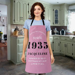 90th Birthday Born 1935 Pink Black Lady's Apron<br><div class="desc">A personalised classic pink apron design for that birthday celebration for somebody born in 1935 and turning 90. Add the name to this vintage retro style pink, white and black design for a custom 90 birthday gift. Easily edit the name and year with the template provided. A wonderful custom birthday...</div>