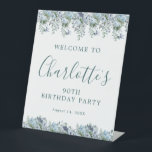 90th Birthday Dusty Blue Floral Welcome Pedestal Sign<br><div class="desc">Welcome your guests with this elegant tabletop pedestal sign. Pretty dusty blue roses,  peonies and wildflowers decorate the top and border. A classic and easy-to-read font combination takes only minutes to personalise.</div>