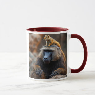 A baboon with a squirrel on his head. mug