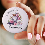 A Baby is Brewing Vintage Teapot and Tea Cups Pink 6 Cm Round Badge<br><div class="desc">A baby is brewing button with vintage tea party design including teapot,  tea cups and pink roses. For co-ordinating invitations,  stationery,  games and day-of-event decor,  please browse my Vintage Tea Party Baby Shower Collection or message me to add any additional items you need.</div>