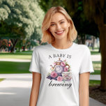 A Baby is Brewing Vintage Teapot and Tea Cups T-Shirt<br><div class="desc">A baby is brewing t-shirt with vintage tea party design including teapot,  tea cups and pink roses. For co-ordinating invitations,  stationery,  games and day-of-event decor,  please browse my Vintage Tea Party Baby Shower Collection or message me to add any additional items you need.</div>