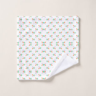 A bathroom towel set displayed against a light wal