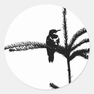 A bird on a branch classic round sticker