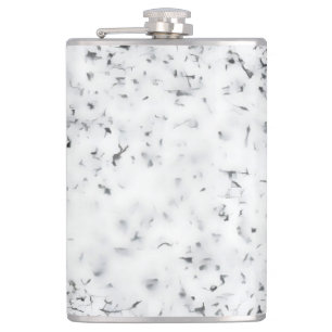 A black and white grainy texture background hip flask