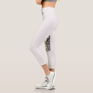 a black and white image of an ornate design capri leggings