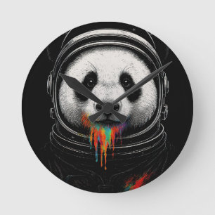 A black and white panda bear wearing a space suit round clock