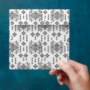 a black and white pattern with a white background envelope