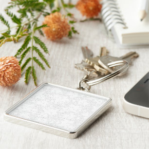 a black and white photo frame with a white backgro key ring