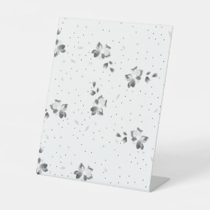 a black and white photo of a bunch of dots pedestal sign