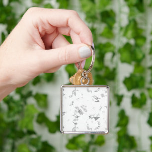 a black and white photo of a white background key ring
