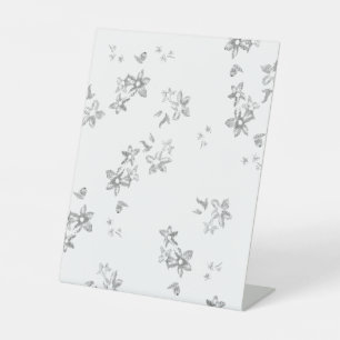 a black and white photo of bubbles on a white back pedestal sign