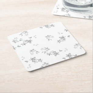 a black and white photo of snow flakes square paper coaster