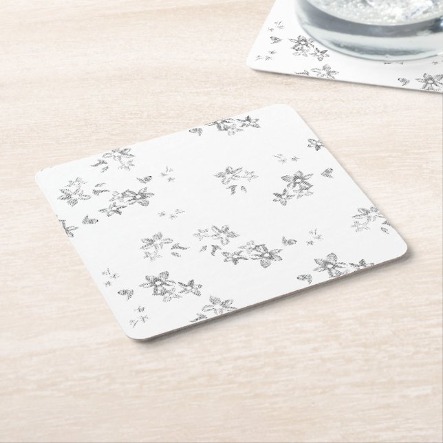 a black and white photo of snow flakes square paper coaster (Angled)