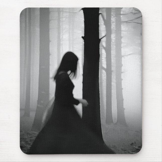 A black shadow brushes past the tree mouse pad (Front)