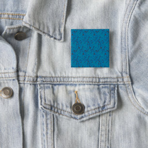 a blue and black background with a pattern 15 cm square badge