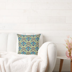 a blue and green pattern on a green background cushion