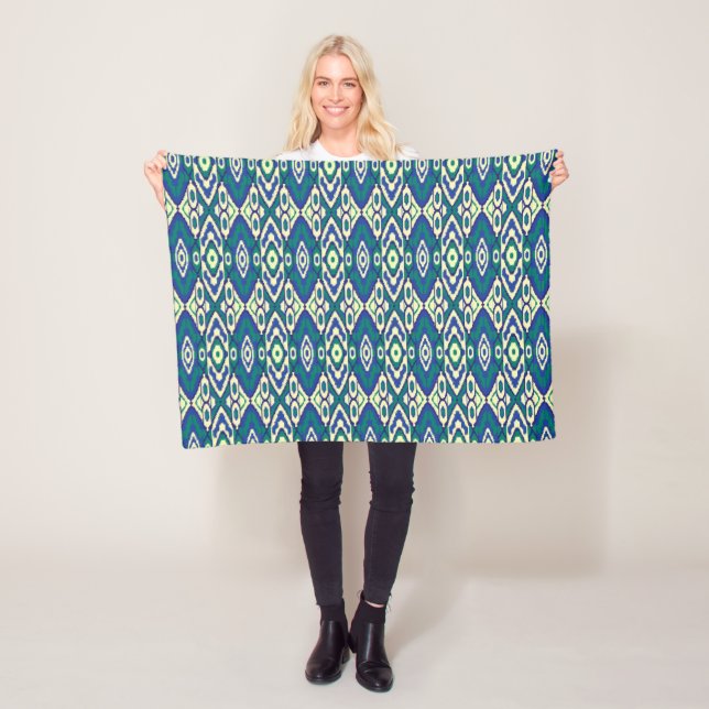 a blue and green pattern with a white background fleece blanket (In Situ)
