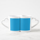 a blue background with a black and white cat coffee mug set<br><div class="desc">Explore the charming contrast of a black and white cat against a serene blue background. This captivating image captures the essence of a beloved pet on a unique backdrop."</div>