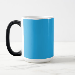 a blue background with a black and white cat magic mug