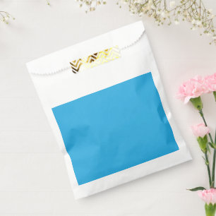 a blue background with a black and white cat on to favour bags