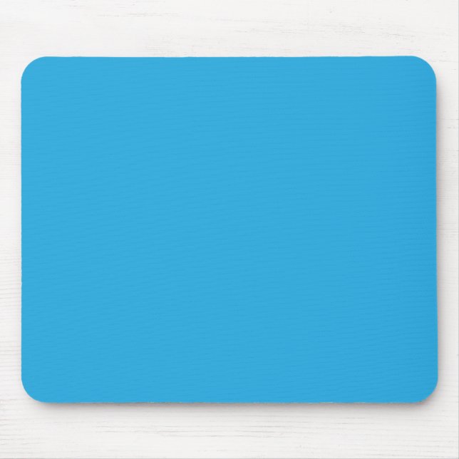 a blue background with a black and white cat on to mouse pad (Front)