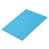 a blue background with a black and white cat on to