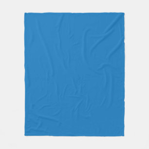 a blue background with a black and white clock fleece blanket