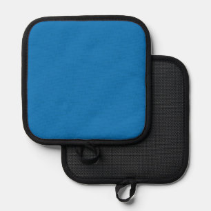 a blue background with a black and white clock pot holder
