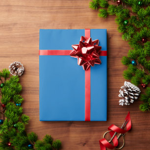 a blue background with a black and white clock wrapping paper