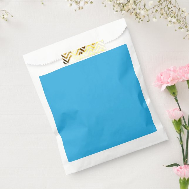 a blue background with a favour bags (Sealed)