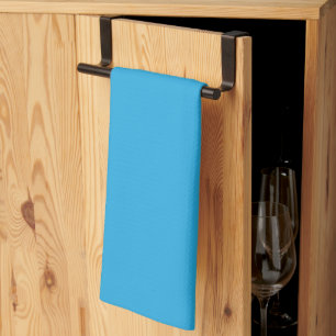a blue background with a tea towel