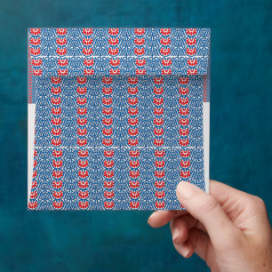 a blue background with red and white designs envelope