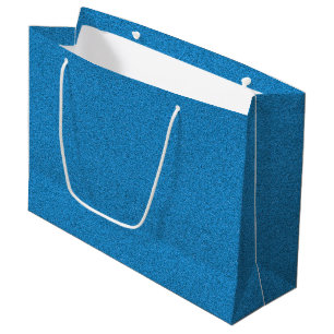 A blue gift bag with white handles