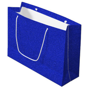 A blue glitter gift bag with white handles