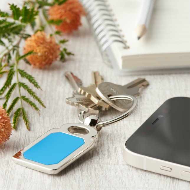a blue sky with a plane flying in the sky key ring (Side)